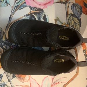 Black Keen slip ons